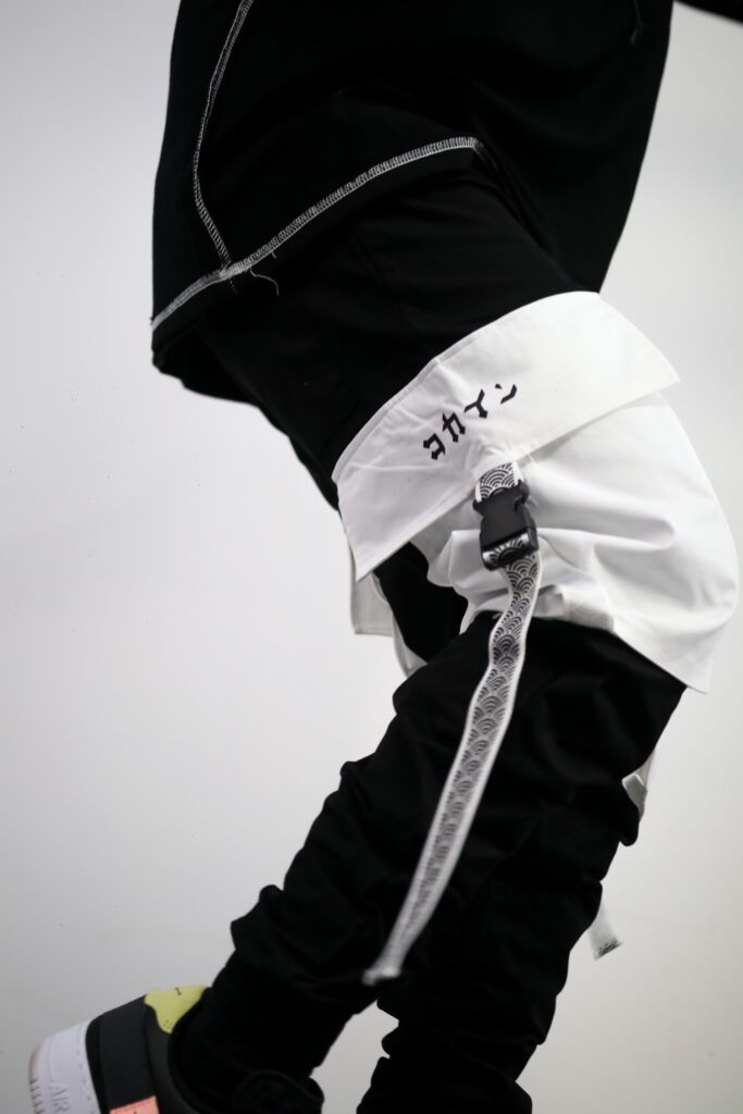 Kokaine tech wear pants, white and black, taken on white studio background