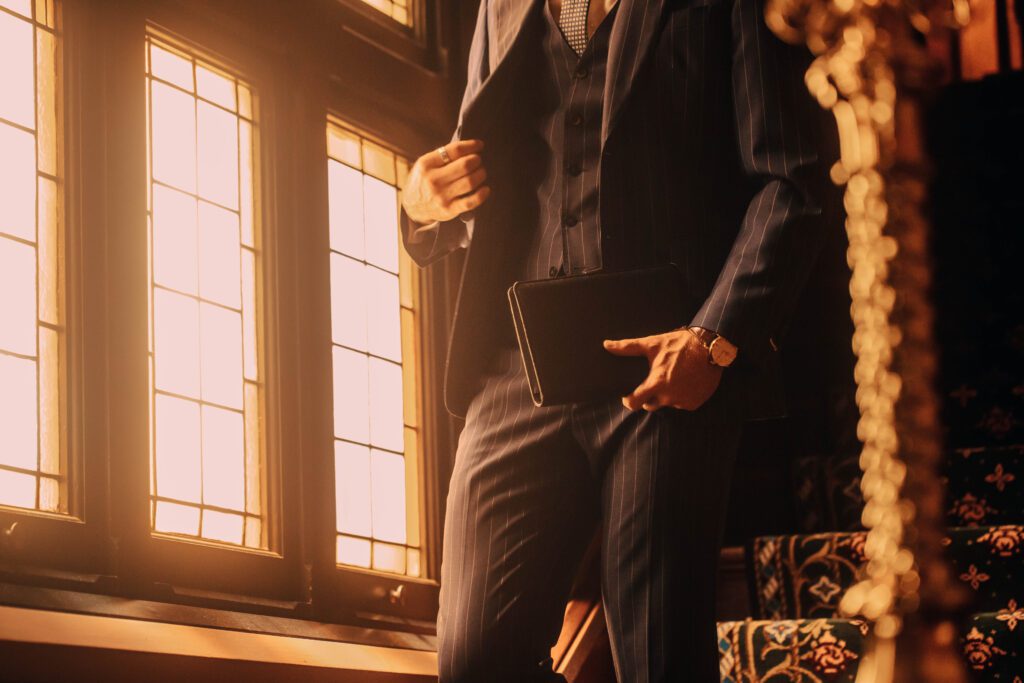 NOTA man in suit reading notebook, professional studio photo and model, in public in melbourne building