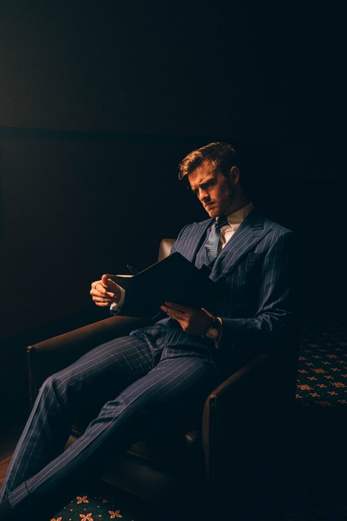 NOTA man in suit reading notebook, professional studio photo and model, in public in melbourne building