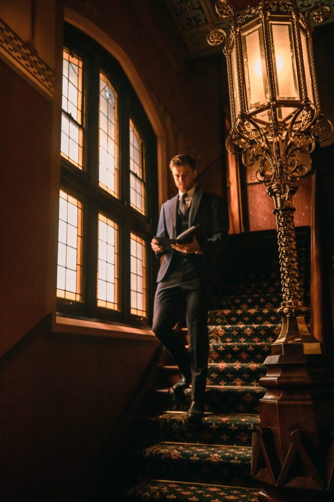 NOTA man in suit reading notebook, professional studio photo and model, in public in melbourne building, old anz buidling