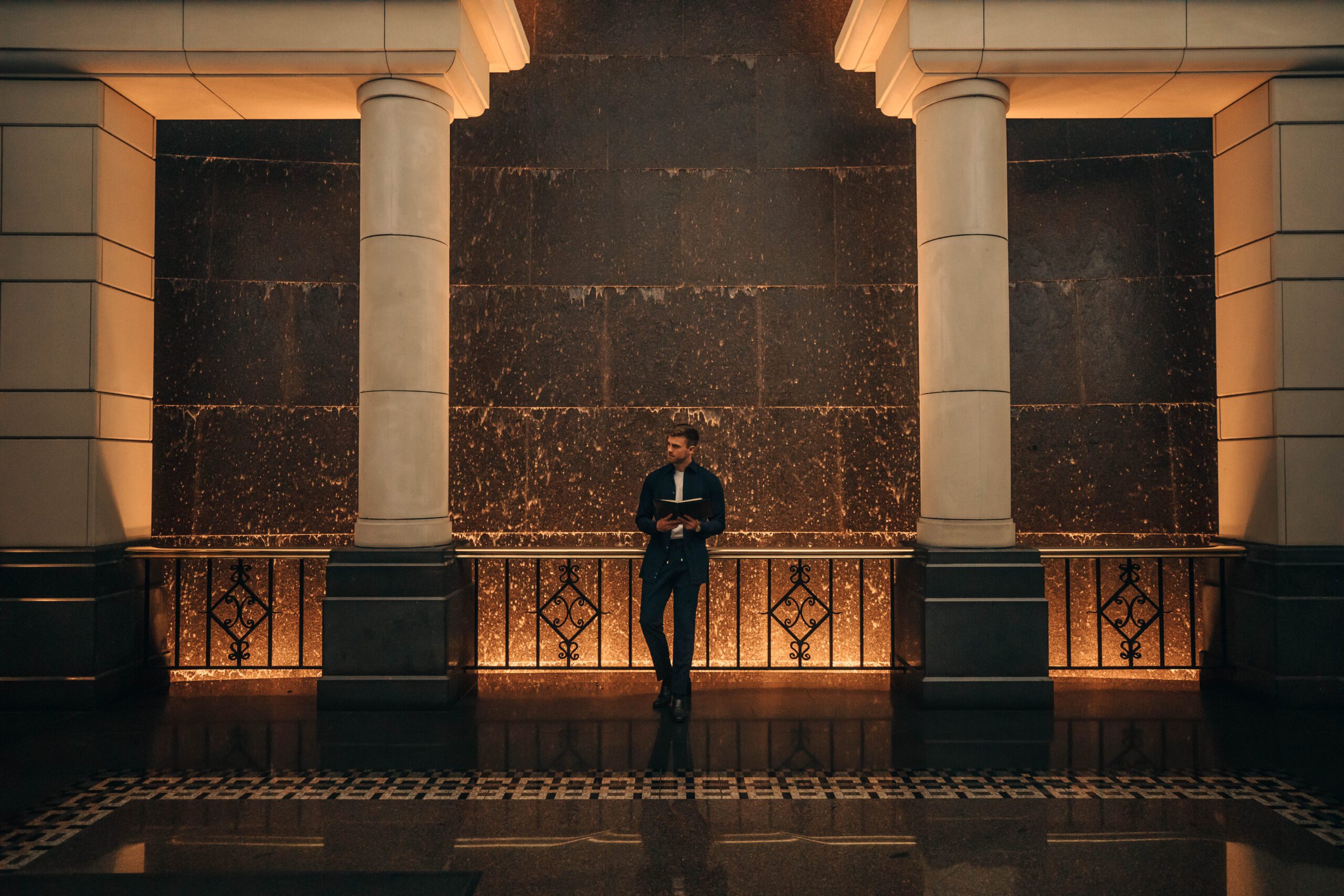 NOTA man in suit reading notebook, professional studio photo and model, in public in melbourne building